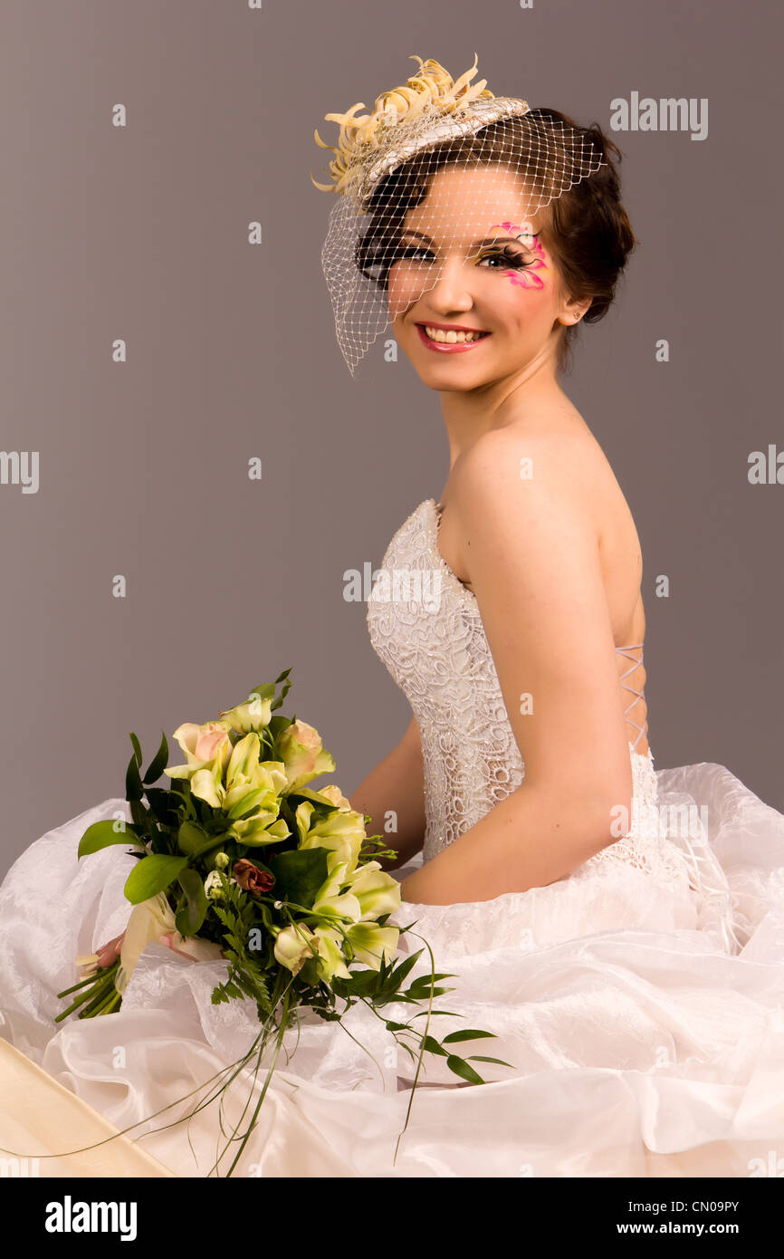 Portrait of a beautiful happy bride in studio Stock Photo - Alamy