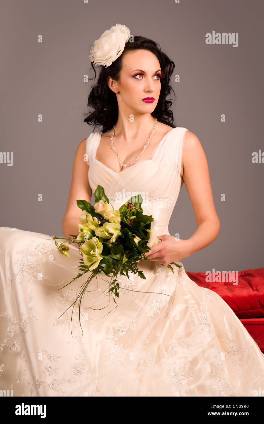 Portrait of a beautiful happy bride in studio Stock Photo - Alamy