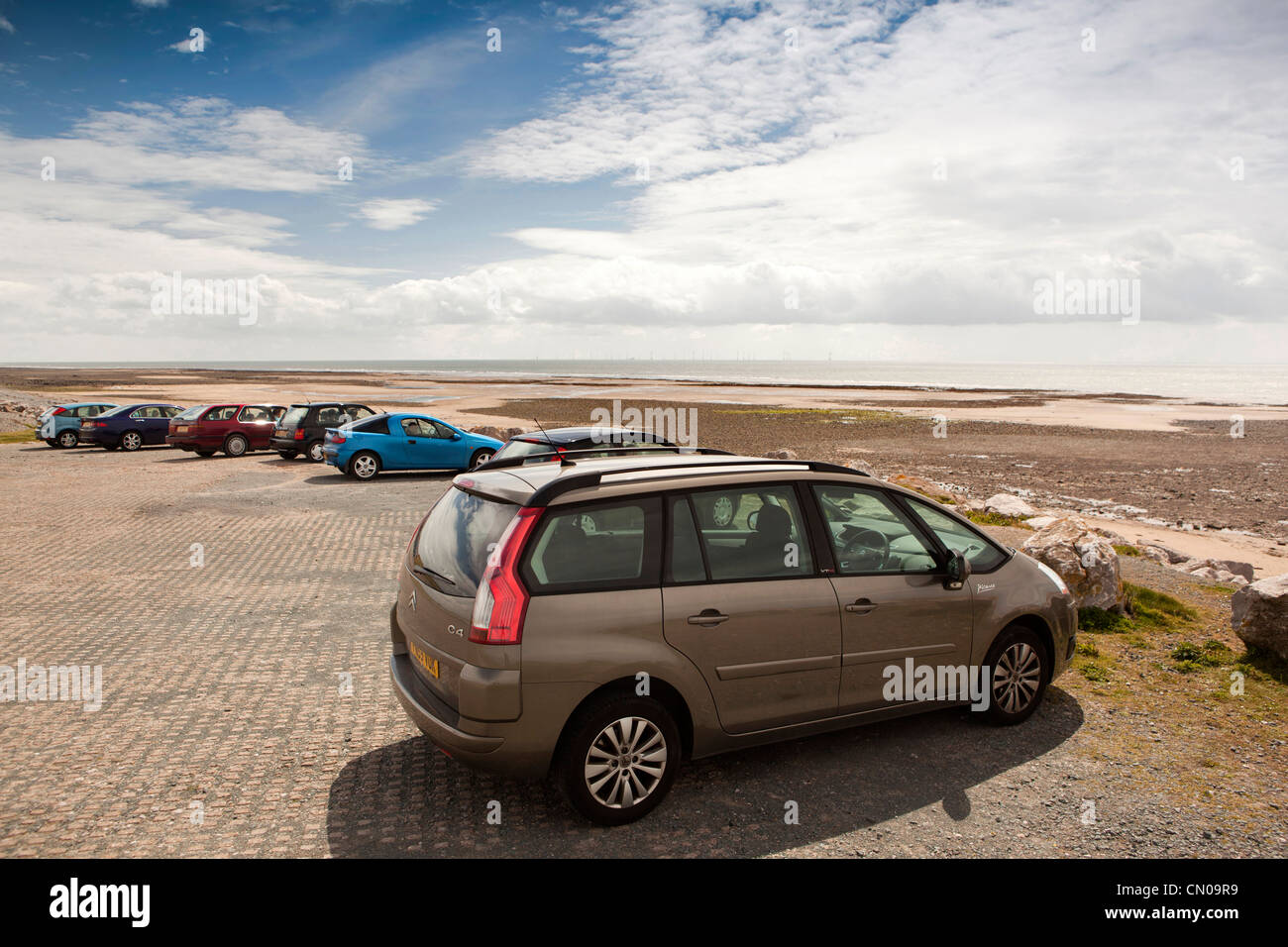 UK, Cumbria, Barrow in Furness, Walney Island, walker’s cars parked at