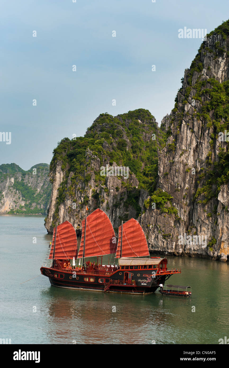 Tourist Junk boat, Red Dragon. Ha Long Bay, Halong Bay. UNESCO World Heritage Site. Vietnam. Stock Photo