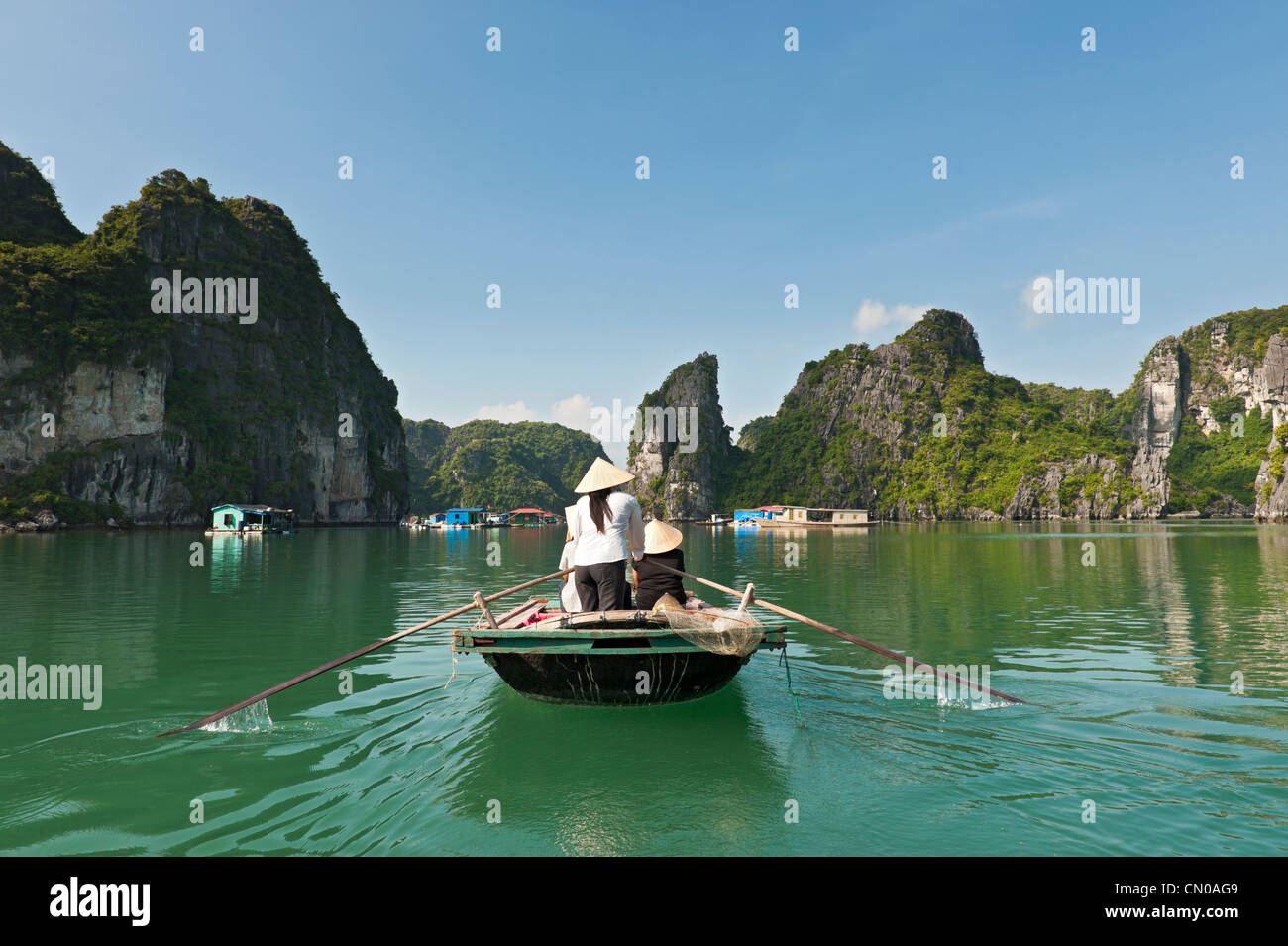 Tourists visiting a pearl fishing village, Ha Long Bay, Halong Bay. UNESCO World Heritage Site. Vietnam. Stock Photo