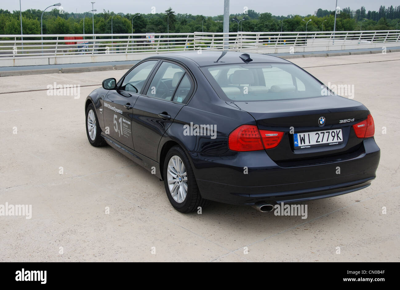 White BMW e91 320i touring with black 18 inch rims Stock Photo - Alamy