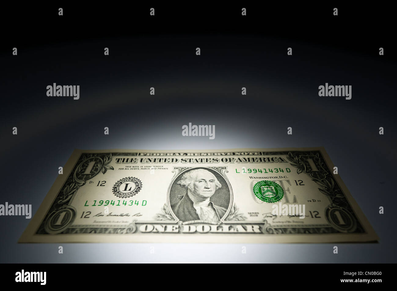 United states one dollar bank note on dark background under spot light Stock Photo