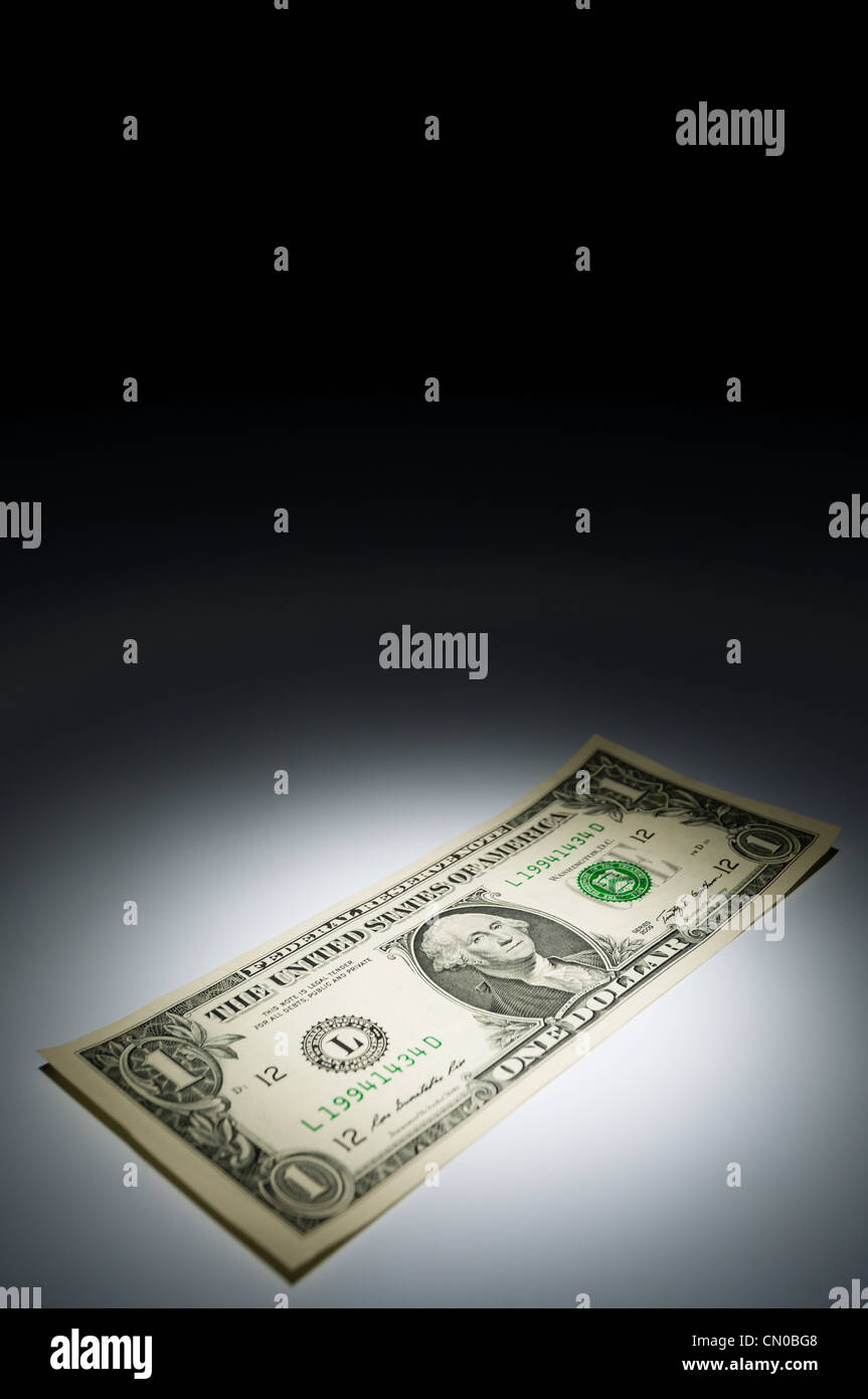United states one dollar bank note on dark background under spot light Stock Photo