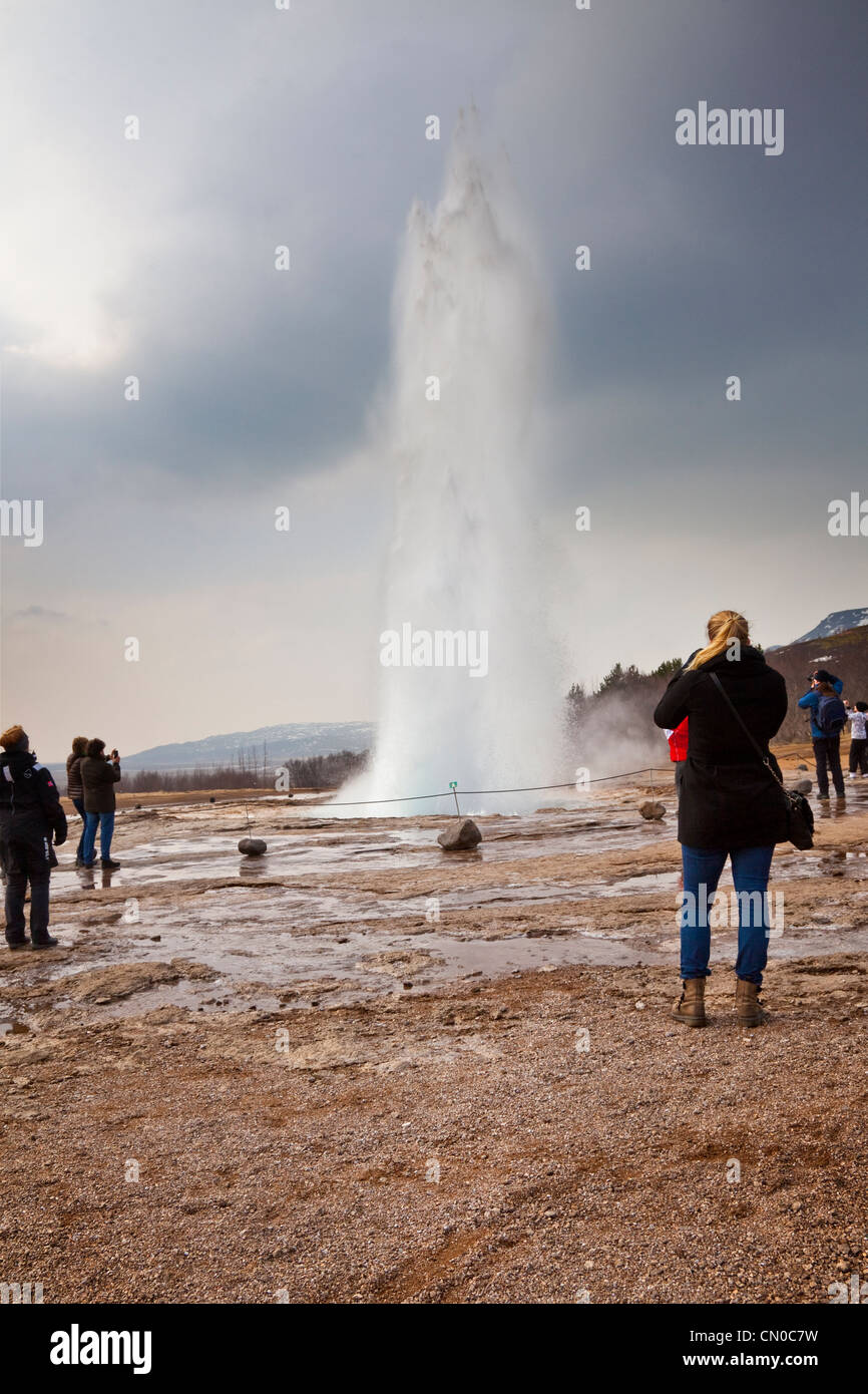 Strokkur, a fountain geyser in the geothermal area beside the Hvítá River in Iceland, exploding high into the air. Stock Photo