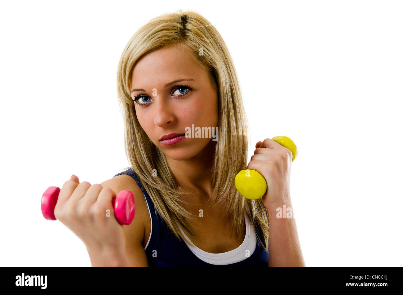 Blonde pretty fitness girl working out with dumbbells Stock Photo Alamy