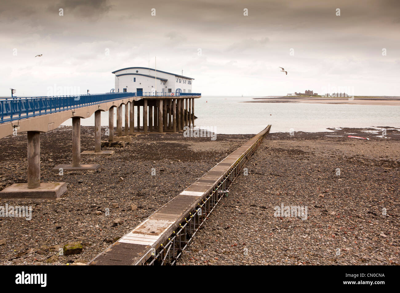 UK, Cumbria, Barrow in Furness, Roa Island, RNLI Lifeboat Station next to Piel Island jetty Stock Photo