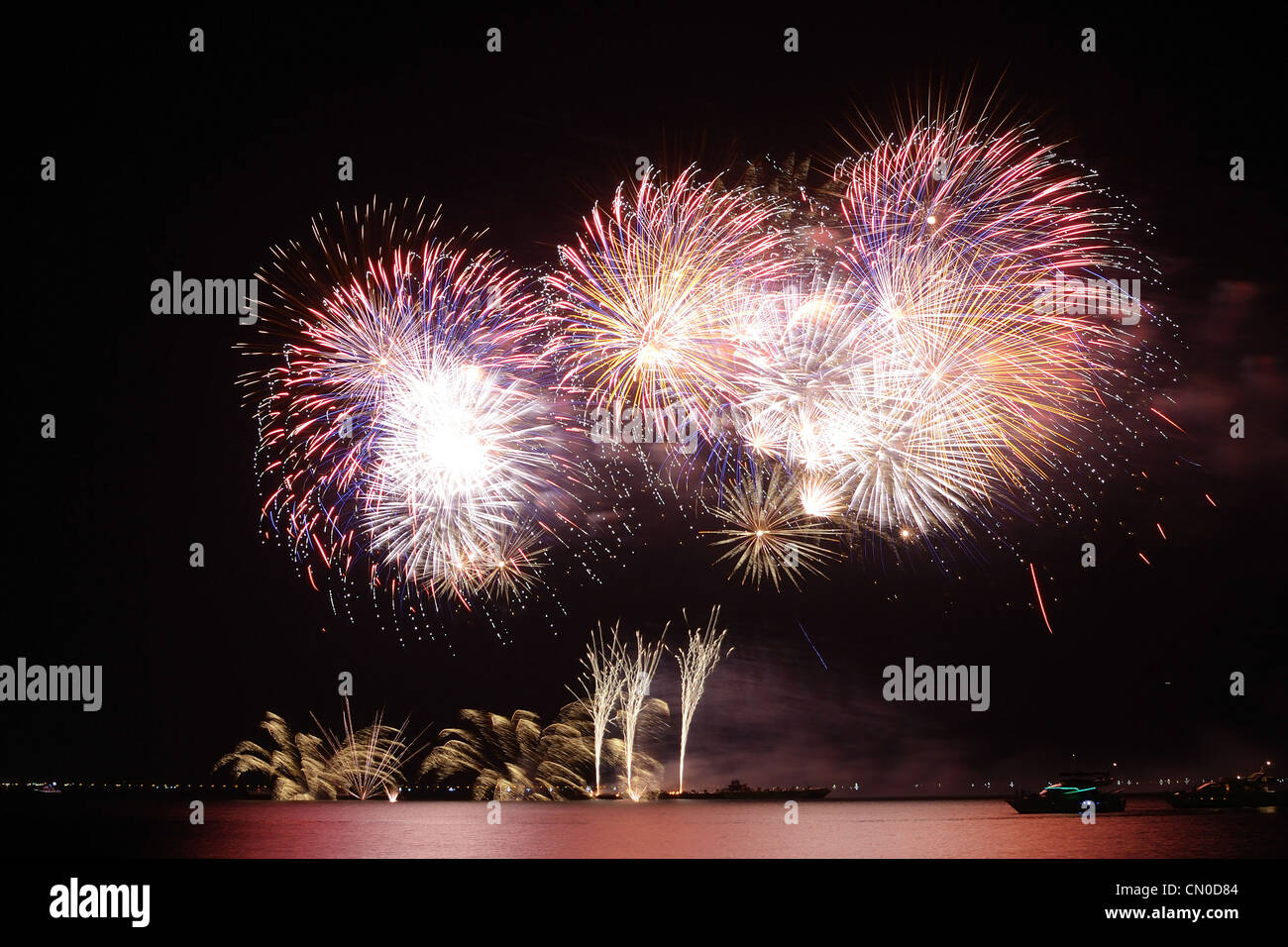 colorful huge fireworks display and reflection Stock Photo - Alamy