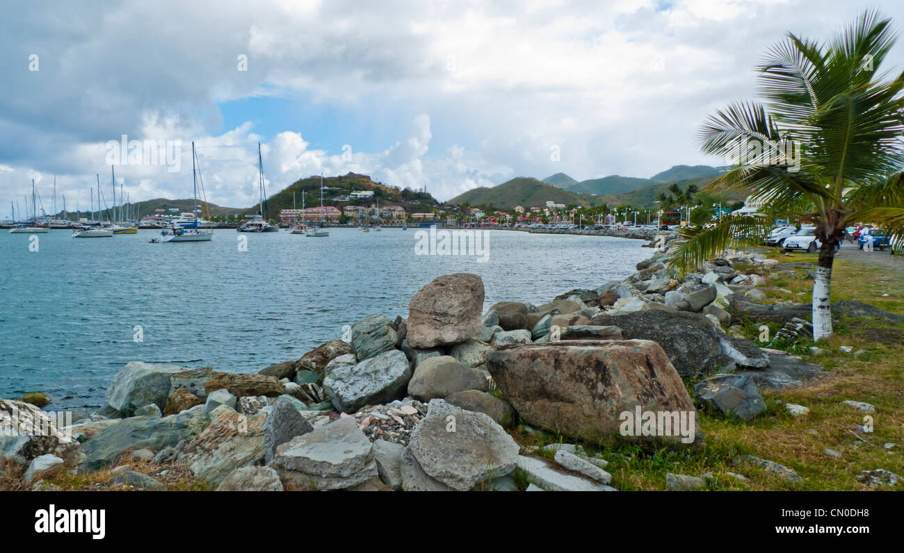 The rocky waterfront along the Marigot harbor in Saint Martin, Caribbean Stock Photo