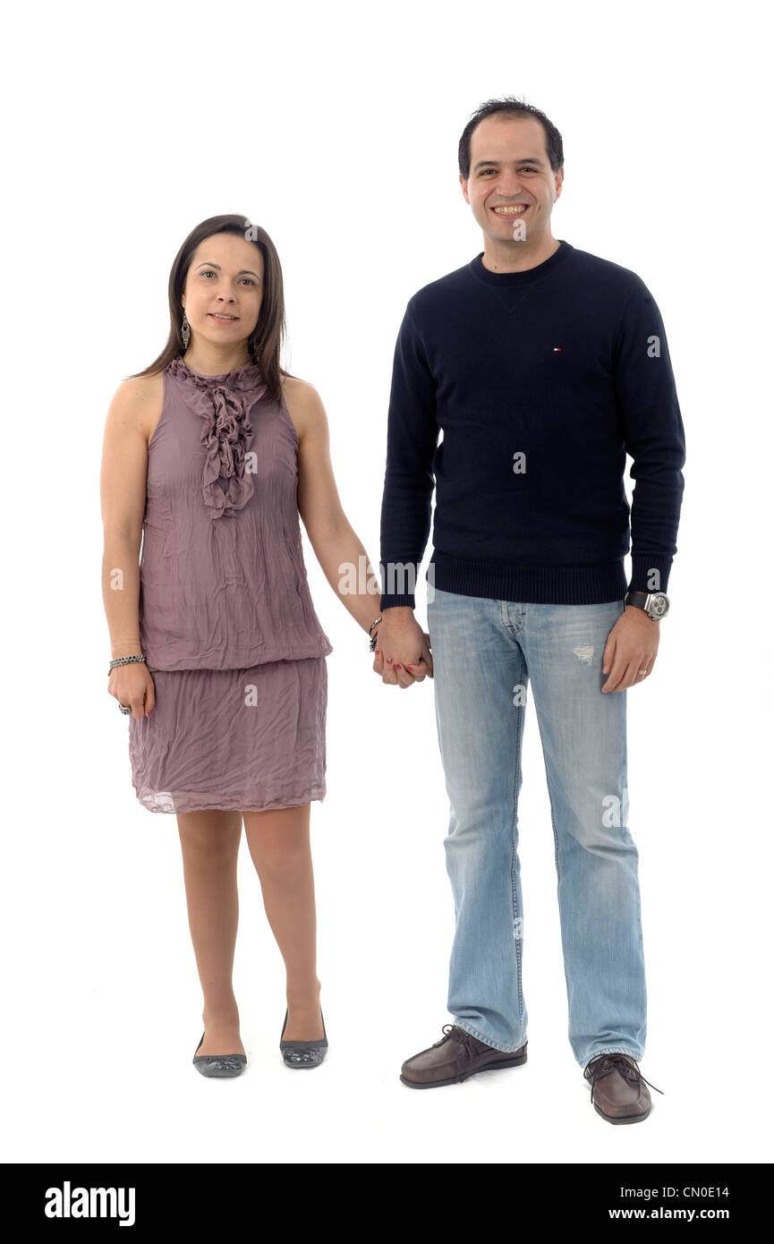 Man and woman side by side holding hands Stock Photo