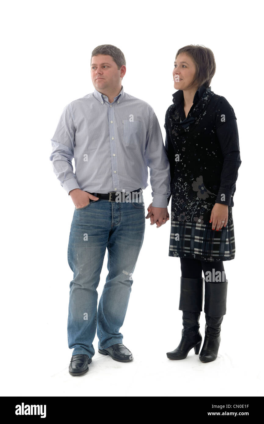 Man and woman side by side holding hands Stock Photo