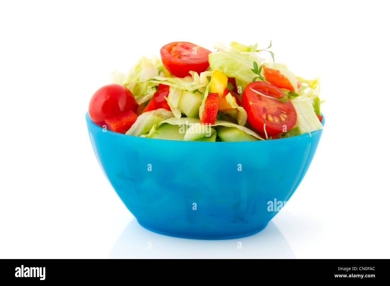 Blue bowl fresh mixed salad with tomatoes Stock Photo Alamy