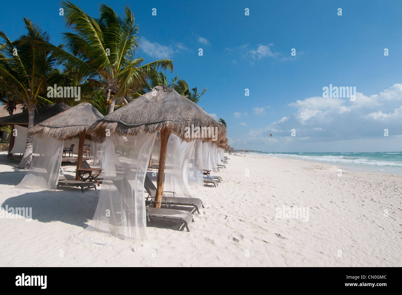palapas on beautiful empty white sand beach Tulum Mexico Stock Photo