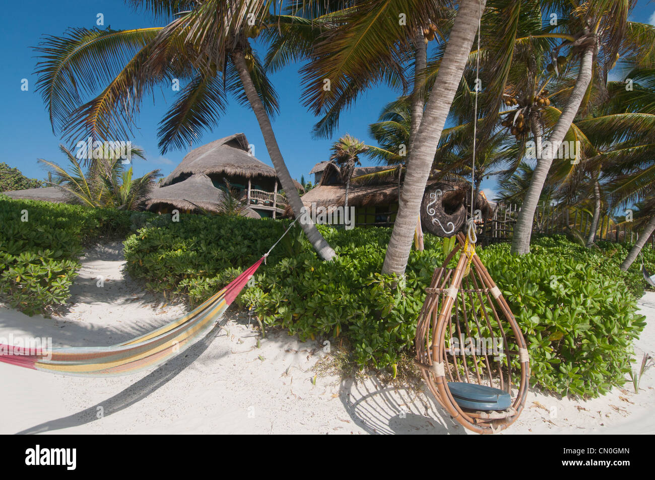 palapas on beautiful empty white sand beach Tulum Mexico Stock Photo