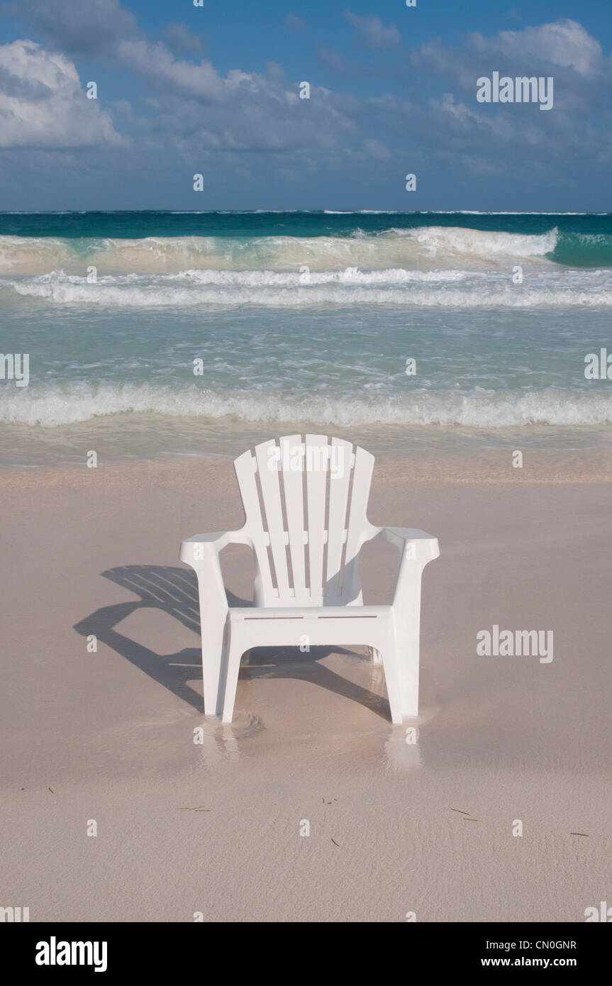 empty beach chair on deserted white sand beach Tulum Mexico Stock Photo