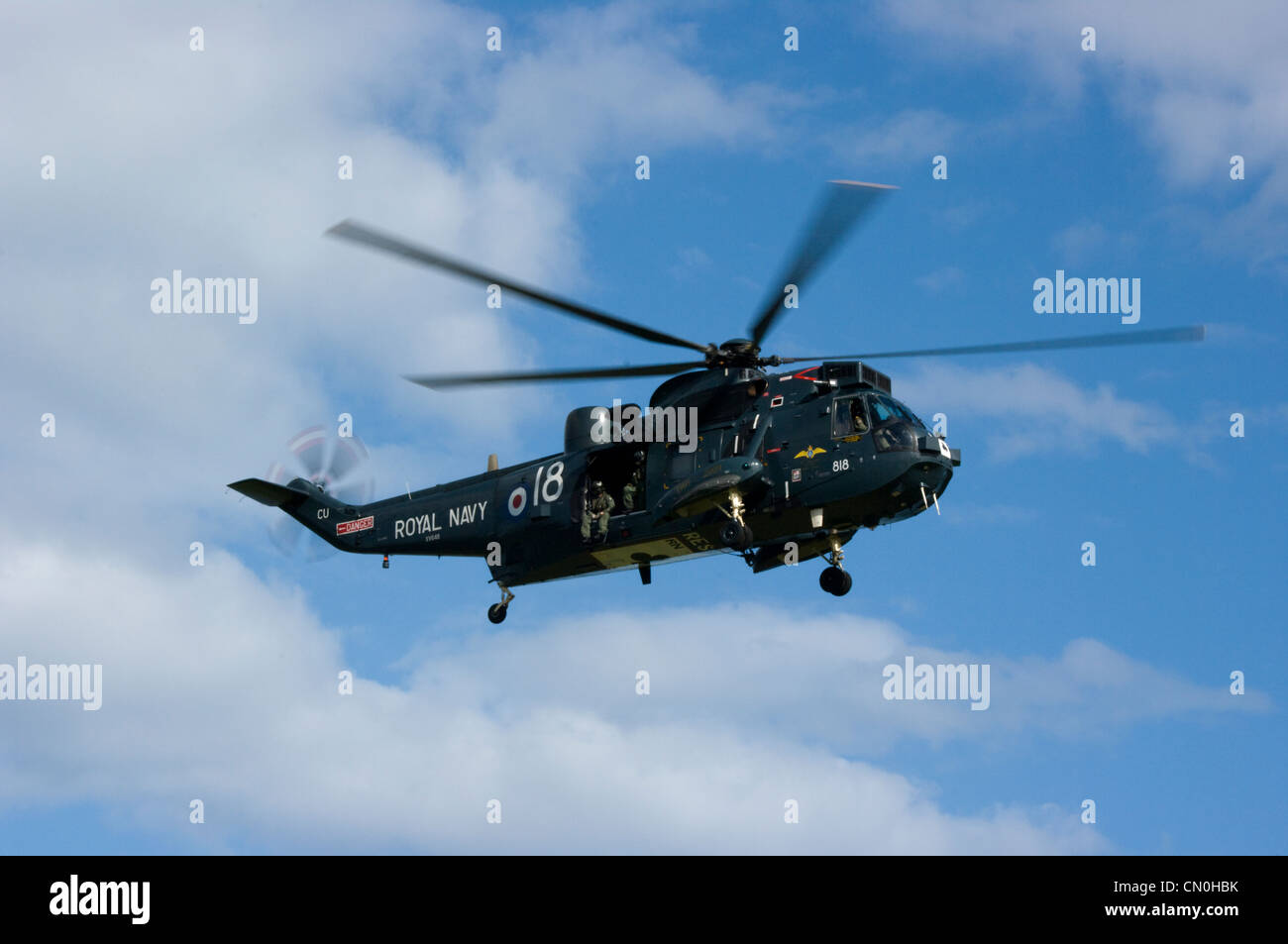 Royal Navy Sea King helicopter wearing vintage 1969 colours departs the Dawlish Air Display ...