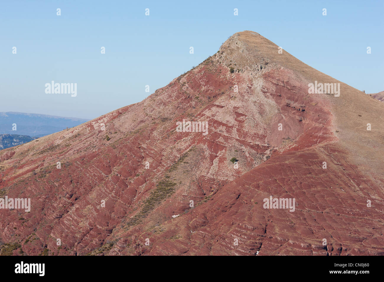 AERIAL VIEW. Tête de Rigaud, a 1907-meter-high summit above the Cians Gorge. Its distinctive red is due to its pelite rock. Alpes-Maritimes, France. Stock Photo