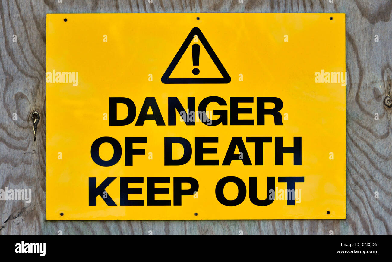 'DANGER OF DEATH KEEP OUT', sign on derelict building.The Promenade, Grange-over-Sands, Cumbria, England, United Kingdom, Europe Stock Photo