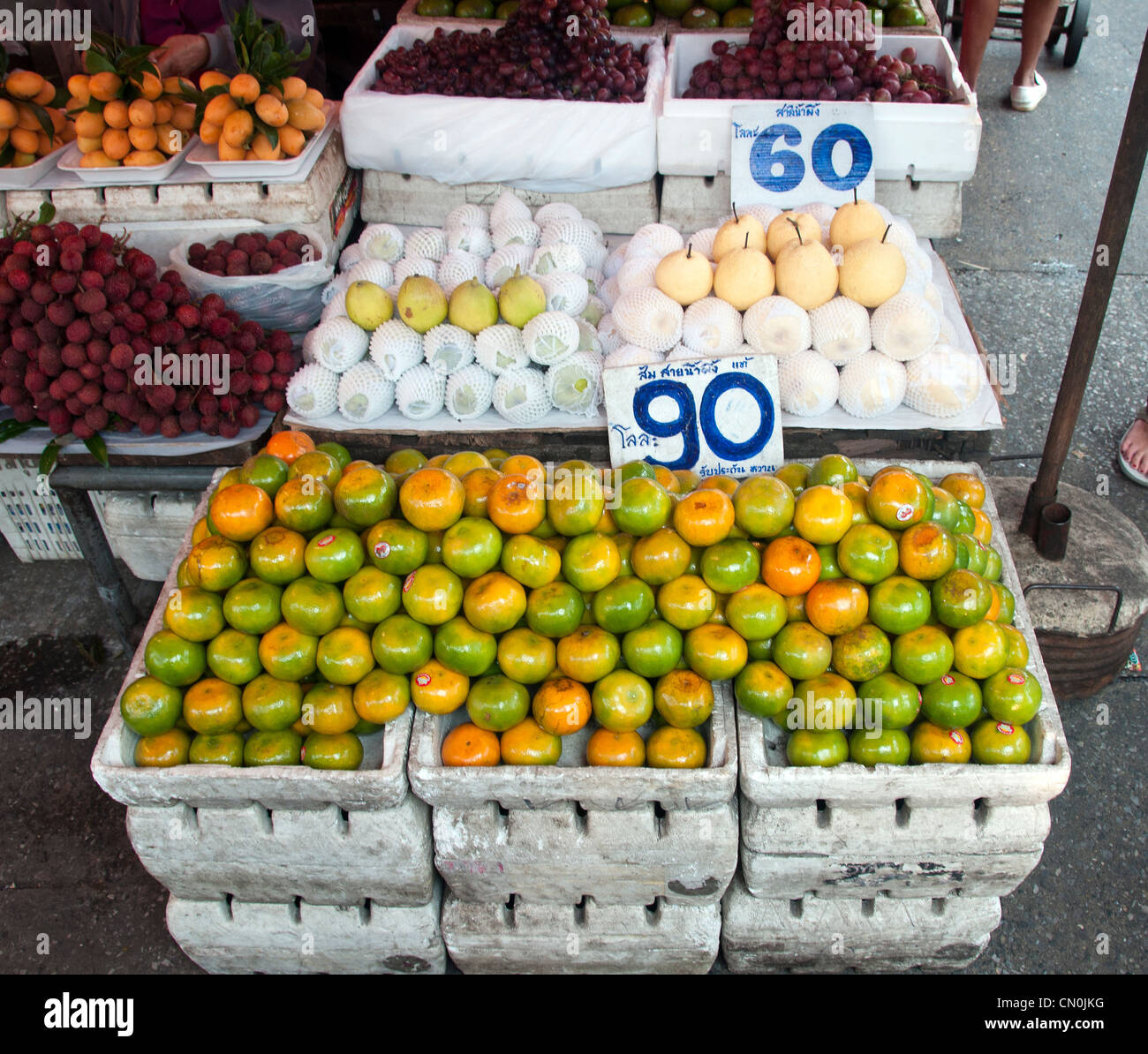 fruit market in bangkok Thailand with mangos and apples Stock Photo