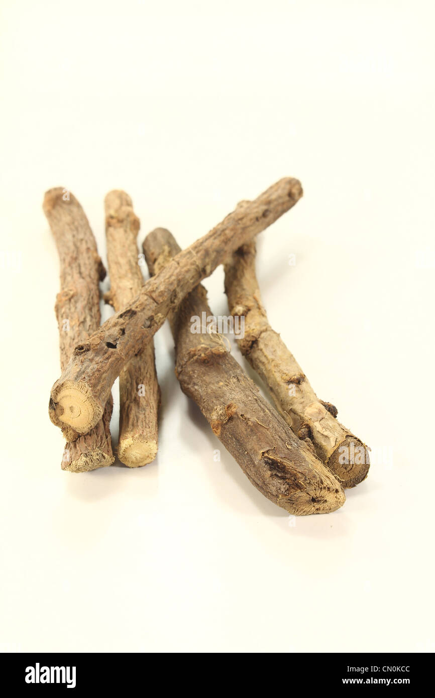 dried liquorice root with liquorice flavoured on a bright background Stock Photo