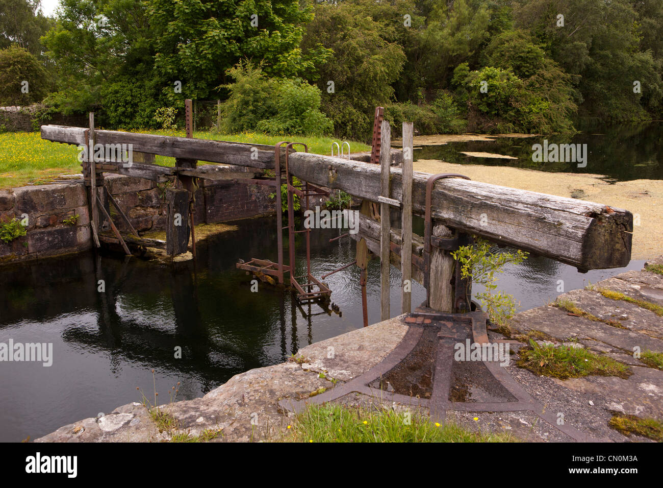 UK, Cumbria, Ulverston, Canal Foot, rotting lock gate at end of disused Ulverston Canal Stock Photo
