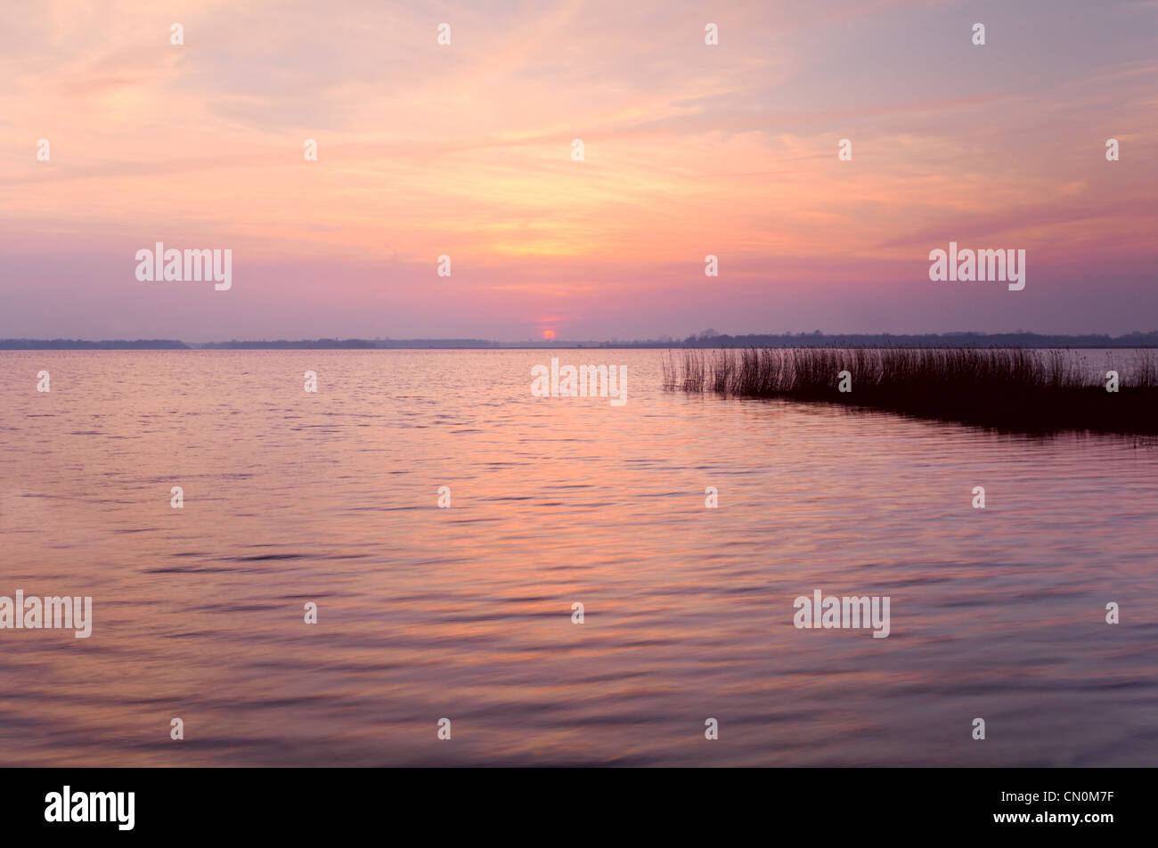 soft pink sunset over big lake Stock Photo