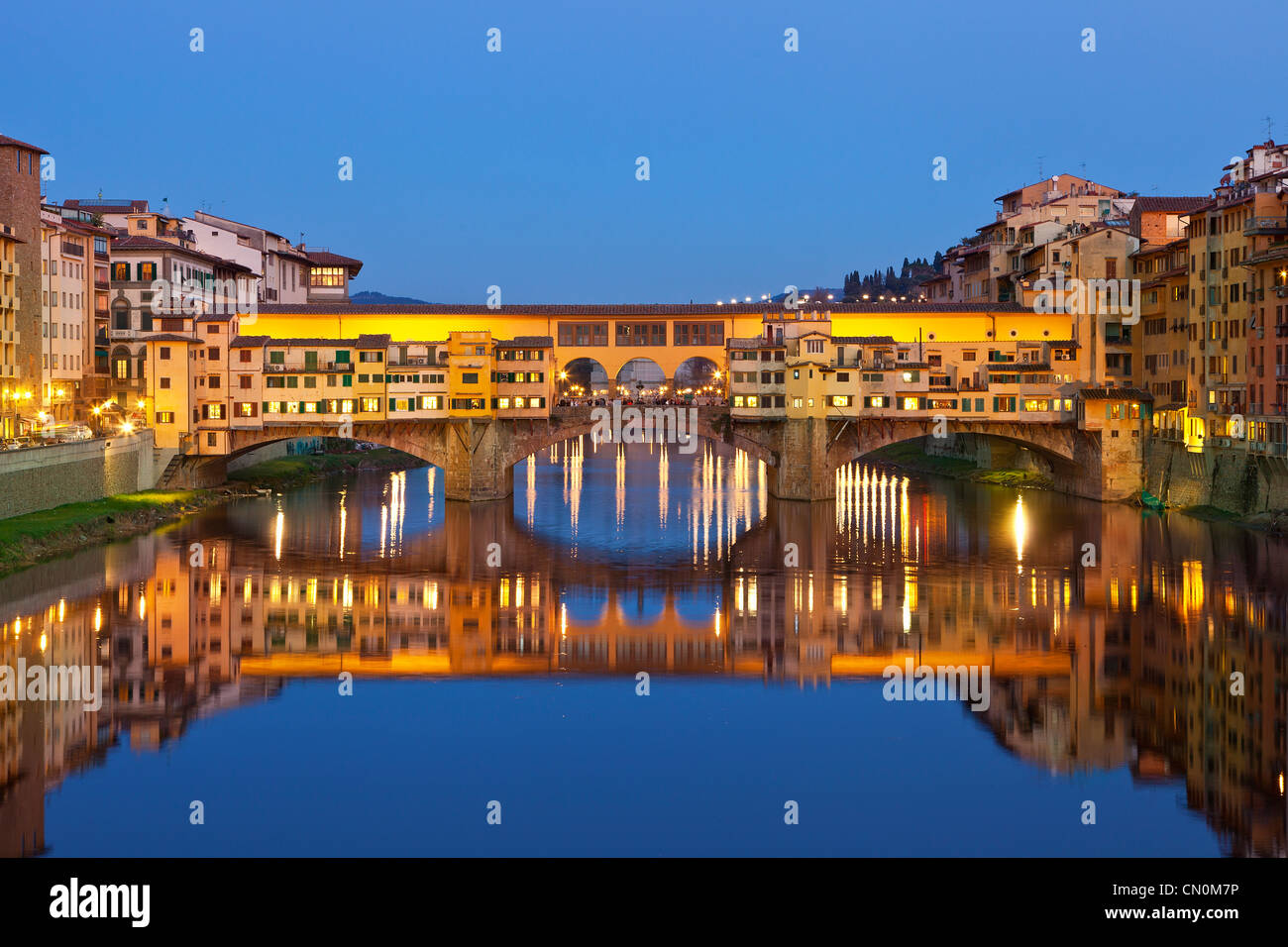 Europe, Italy, Florence, Ponte Vecchio over the Arno River at Dusk Stock Photo