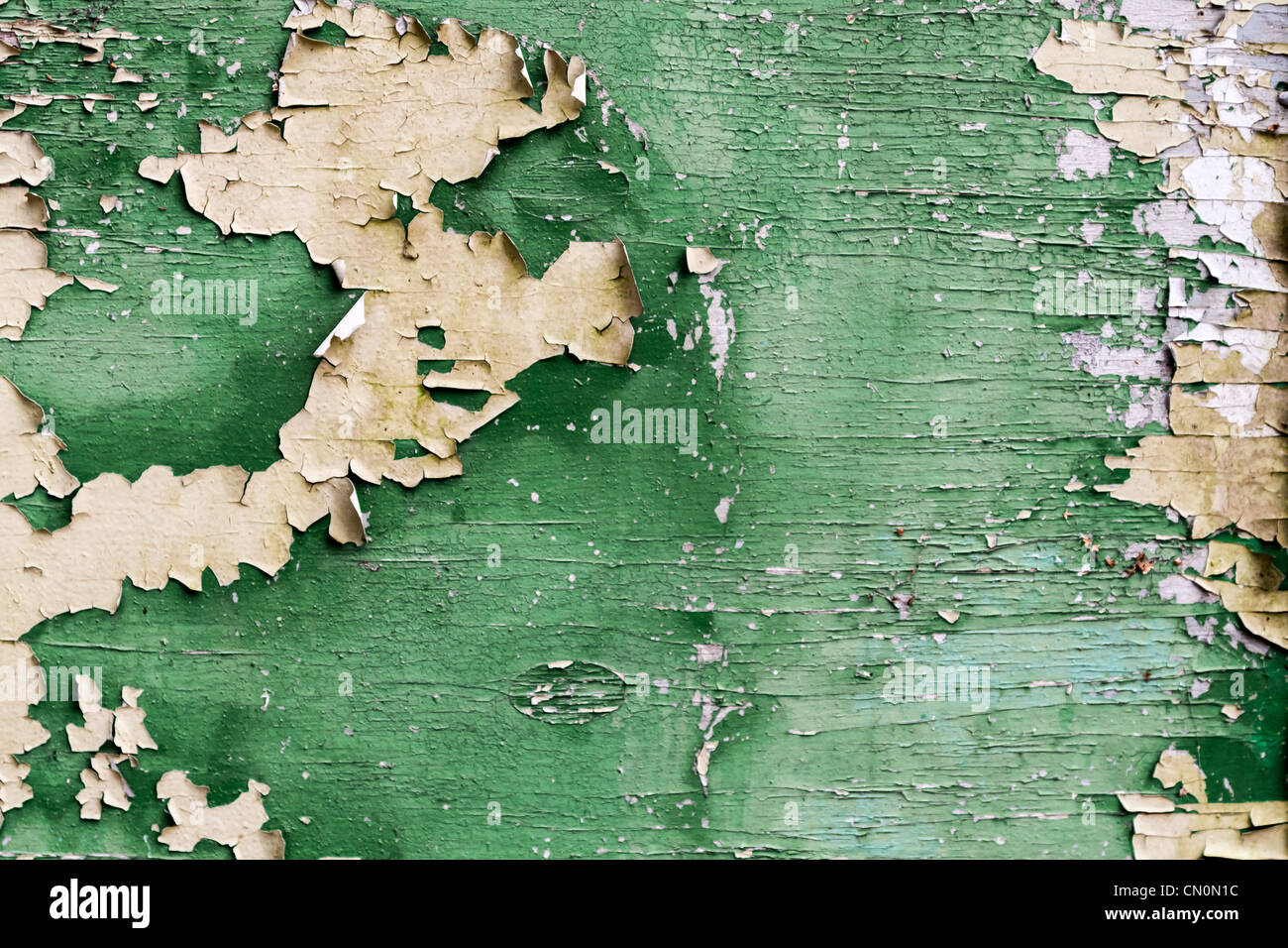 Old green plank with peeling paint Stock Photo