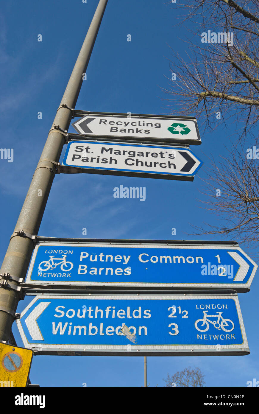 london network cycle signs giving directions and distances to putney common, barnes, southfields