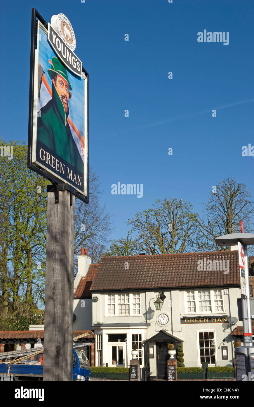 green man pub sign with pub in background, belonging to young's ram brewery, putney, southwest london, england Stock Photo
