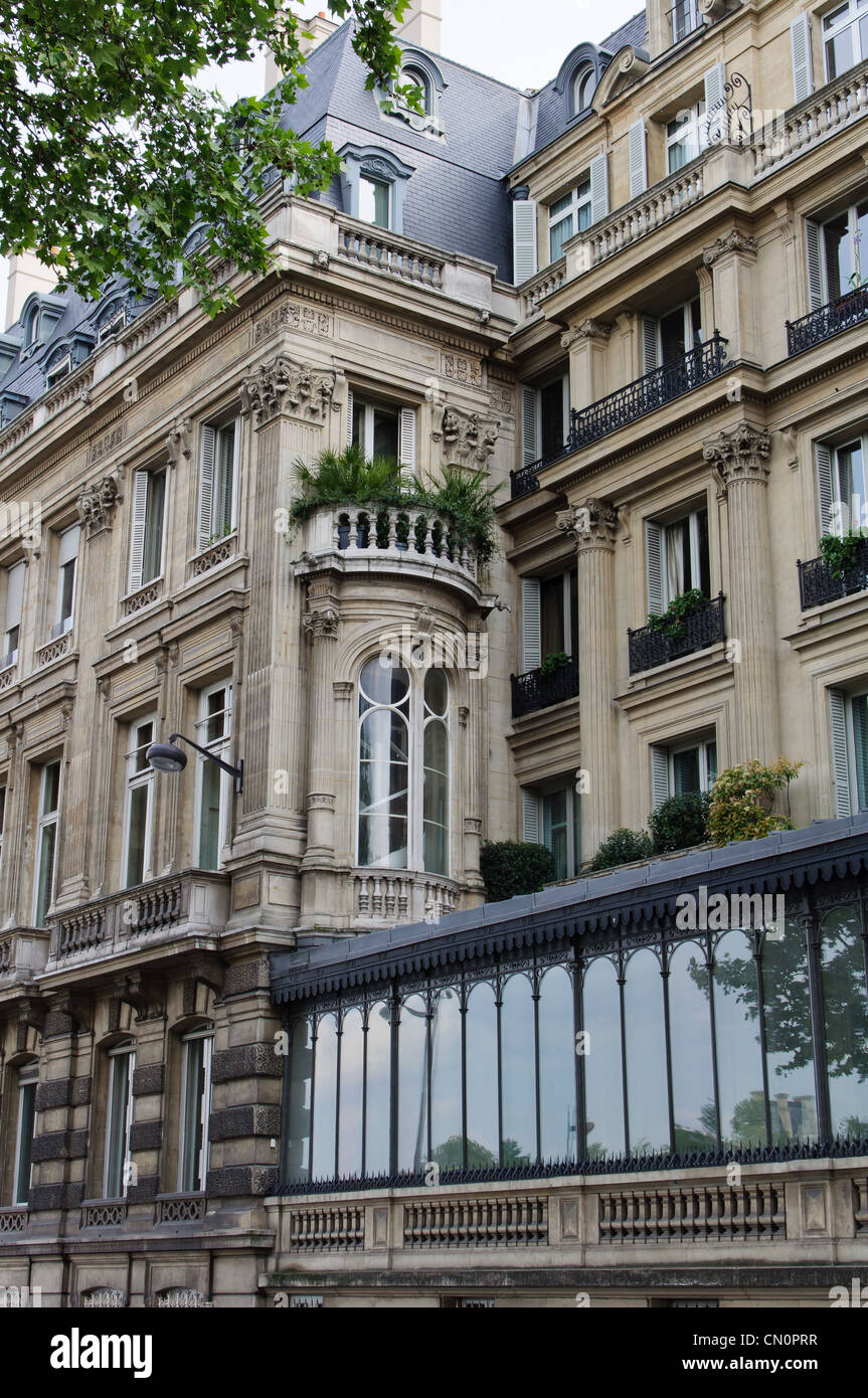 Elegant building in Paris with the typical roof and windows. Stock Photo
