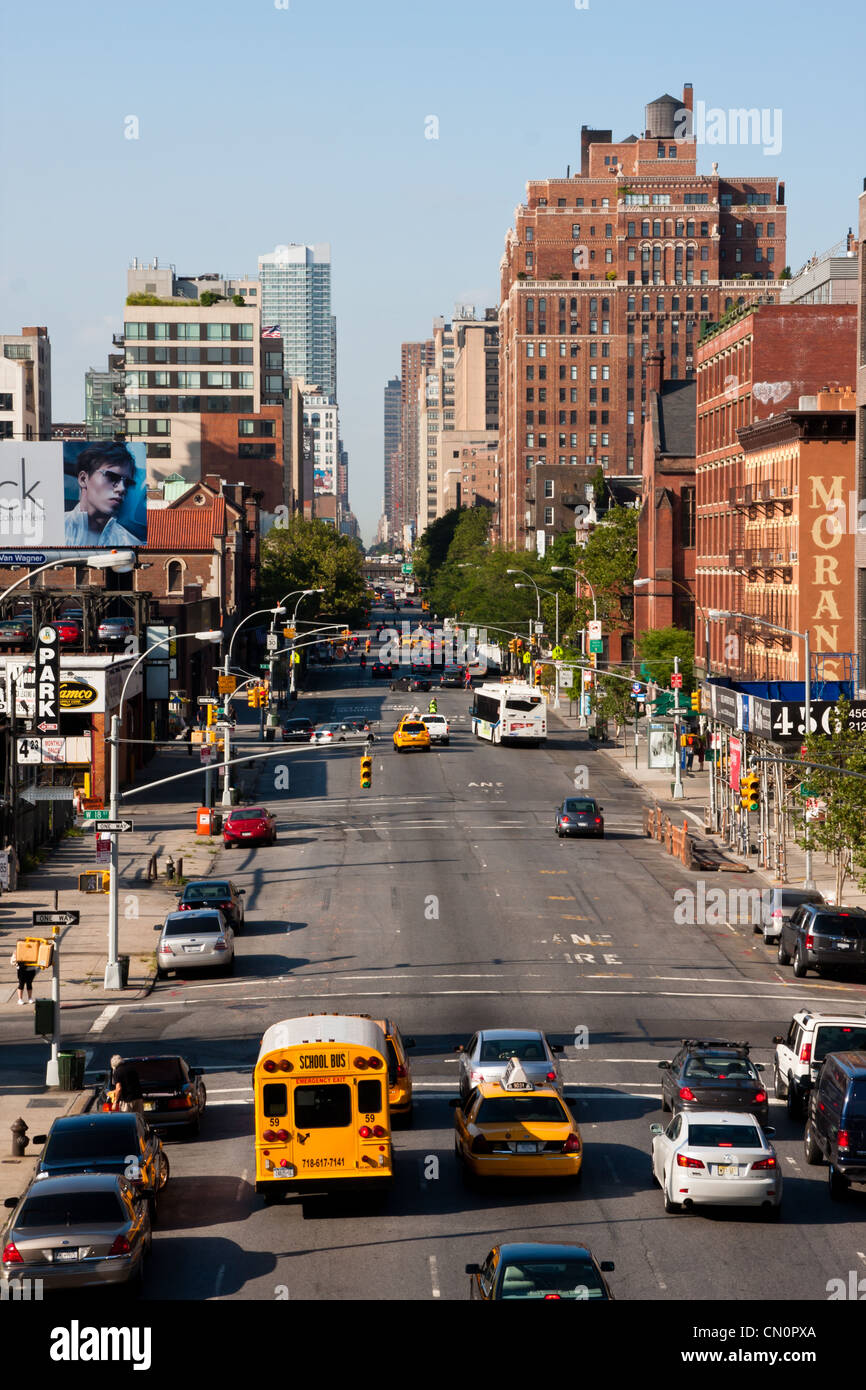 Traffic and pedestrians on 10th Avenue, viewed from the High Line Park near west 17th Street. Stock Photo
