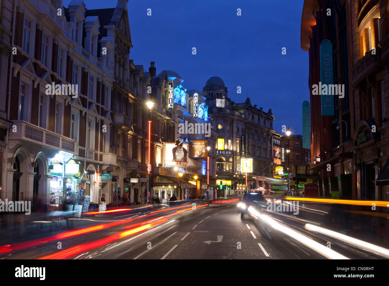 London Theatreland West End Shaftesbury Avenue busy at night with traffic trails London England UK Stock Photo