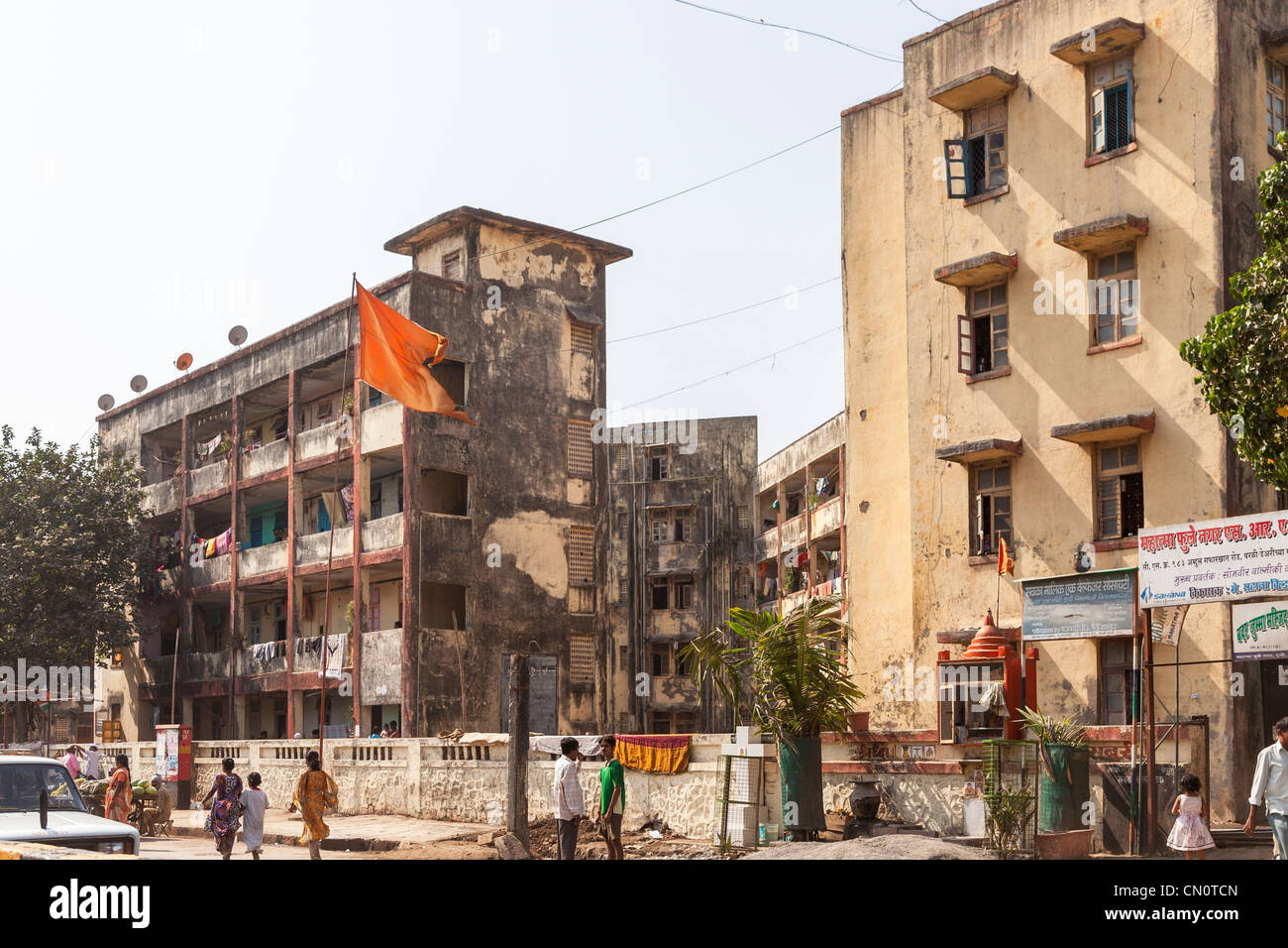 Street view of blocks of dirty and dilapidated flats and apartments in a slum area of Mumbai, India Stock Photo