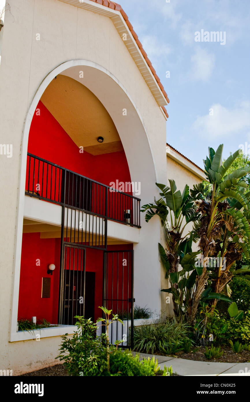 I was wandering down a sidewalk between some buildings and found this red entryway. Stock Photo