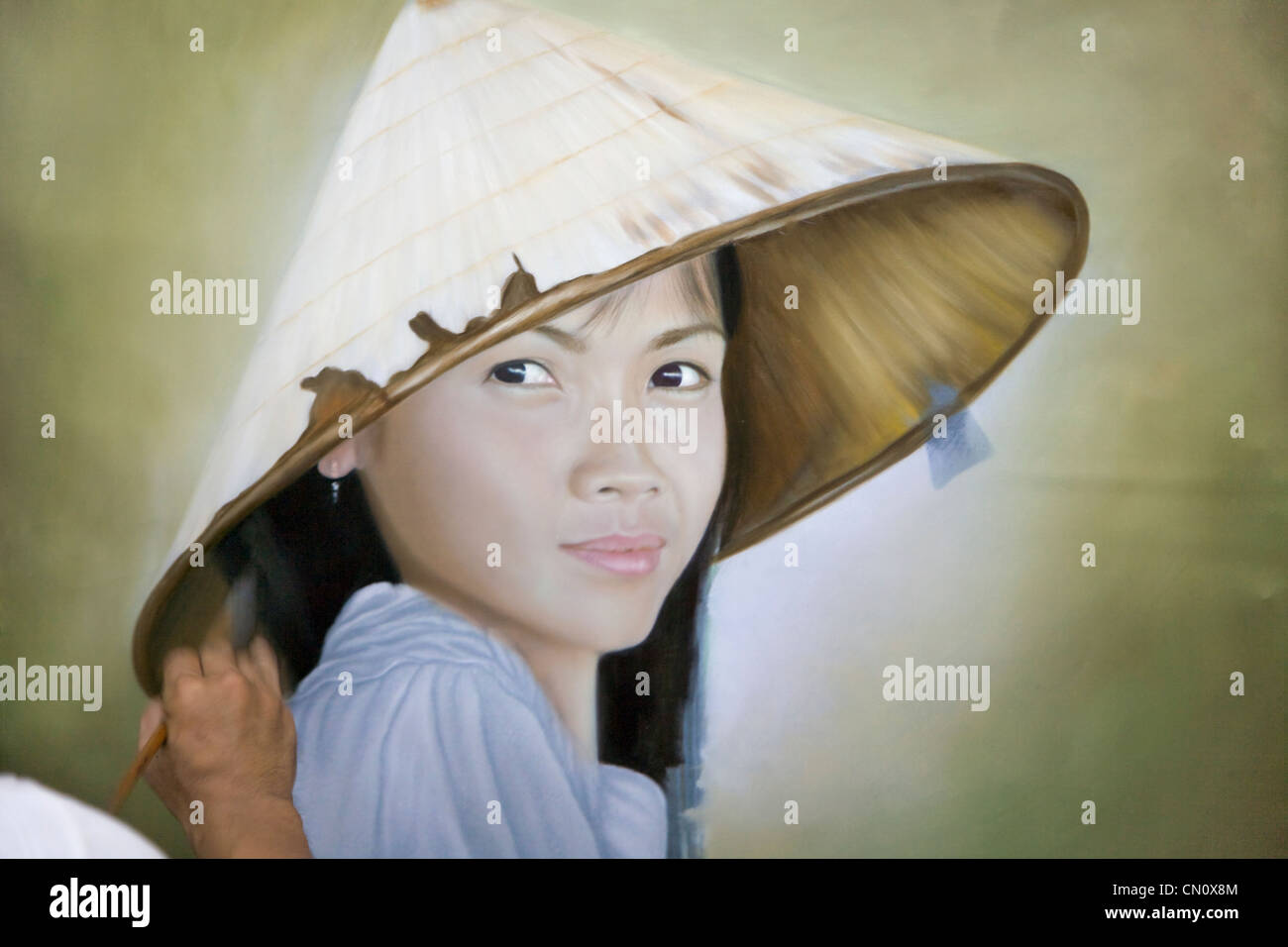 Painting of Vietnamese girl wearing conical hat, Vietnam Stock Photo