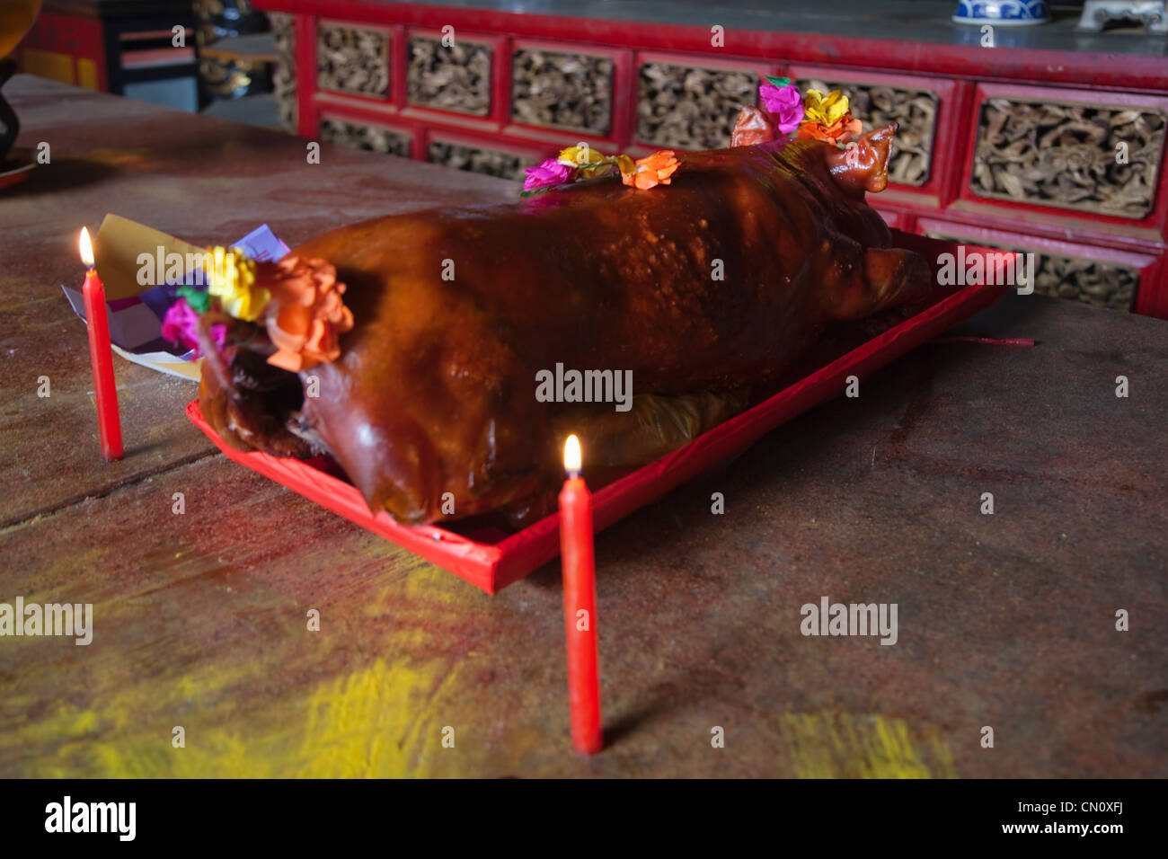 Sacrificial offering of pork in Chinese temple in China Town, Ho Chi ...