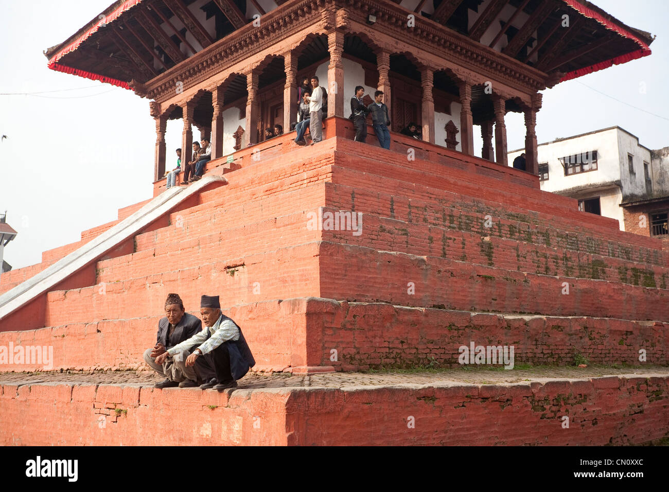 Two mature Newari man at Maju Deval in Durbar Square - Kathmandu, Bagmati Zone, Kathmandu Valley, Nepal Stock Photo