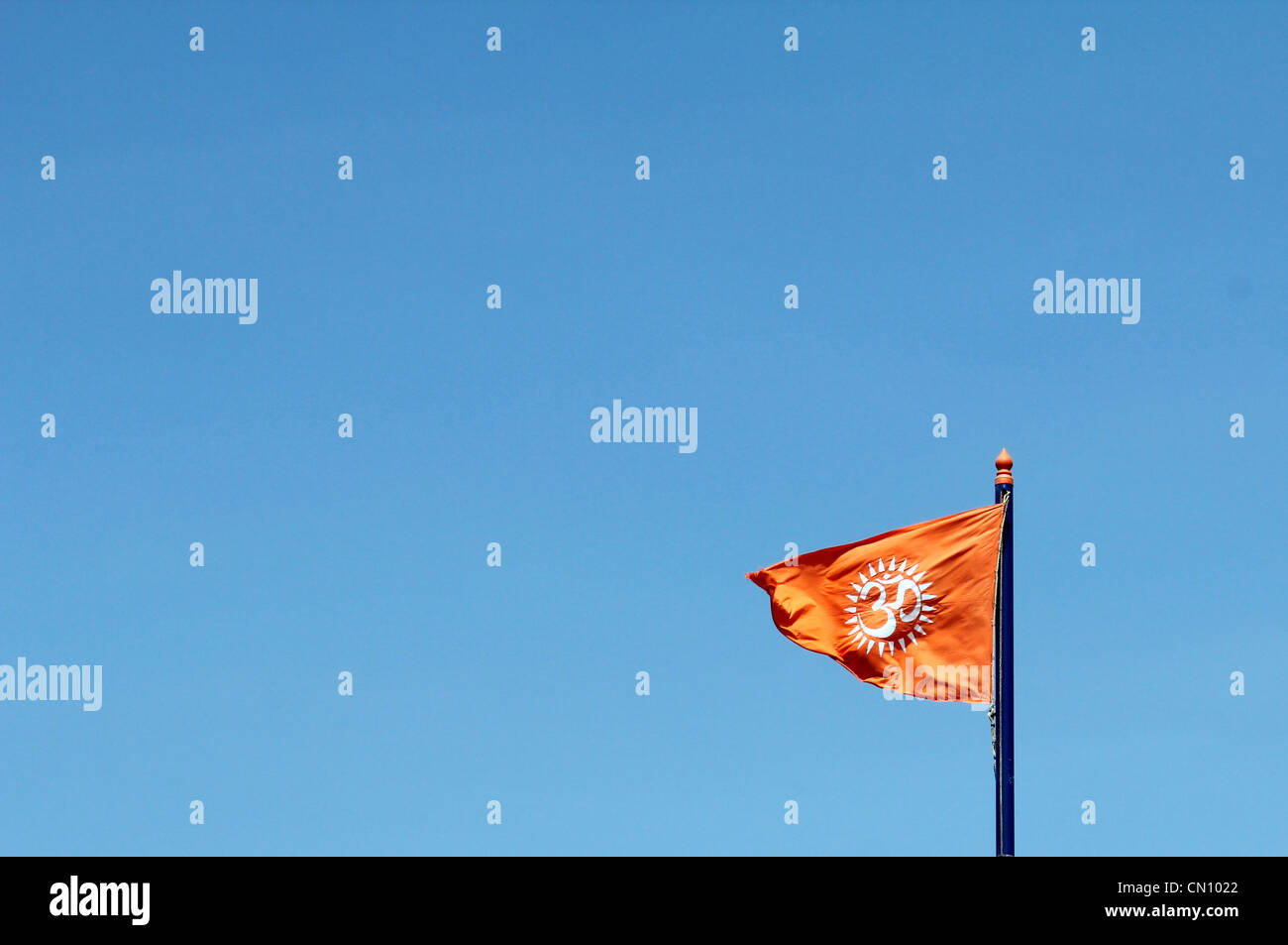 Fluttering flag depicting hindu symbol AUM Stock Photo