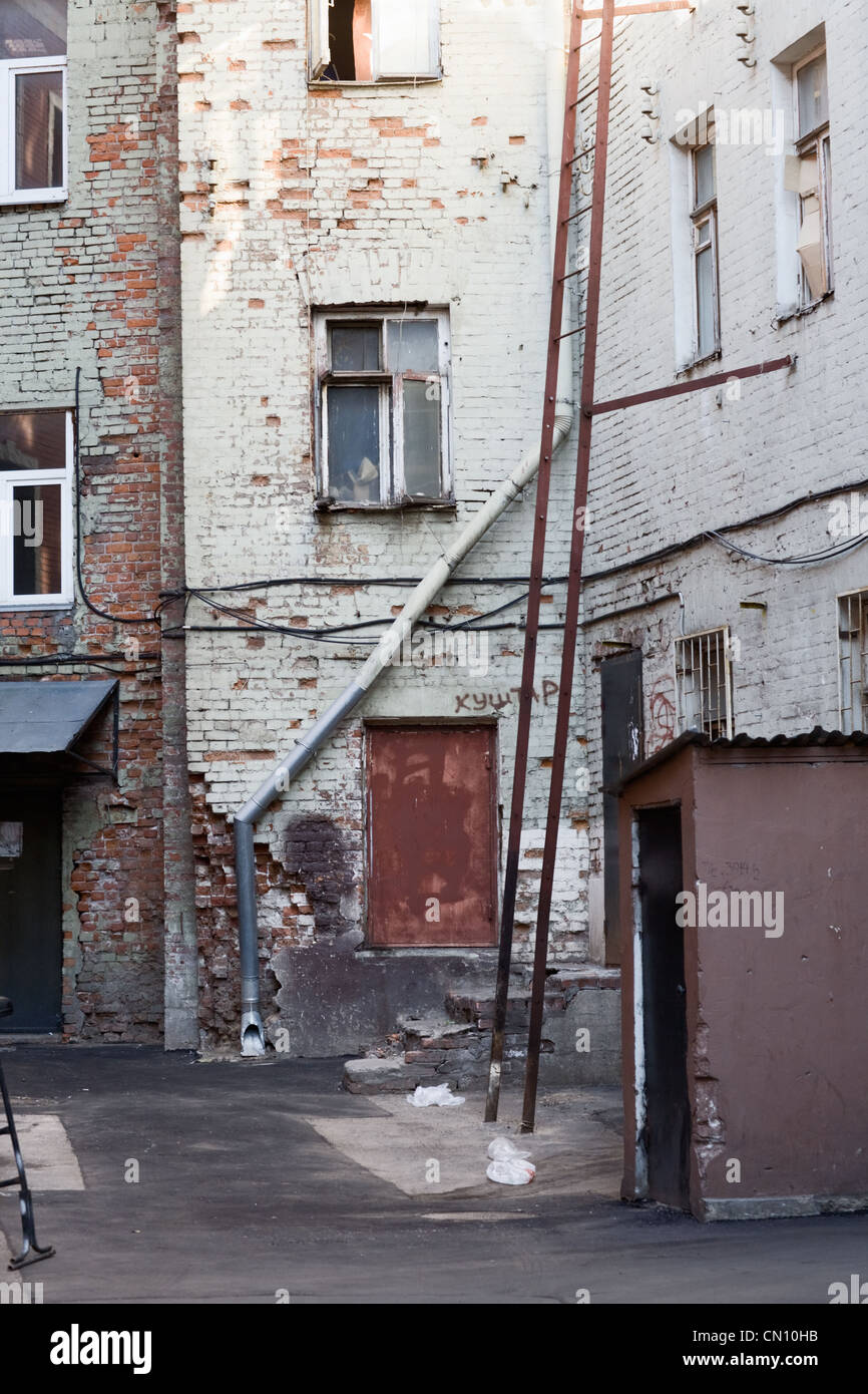 Backyard of abandoned residential building Stock Photo