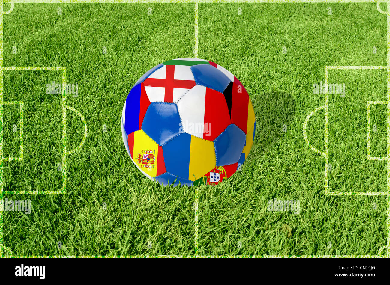 Soccer ball on grass field background. Ball filled with euro 2012