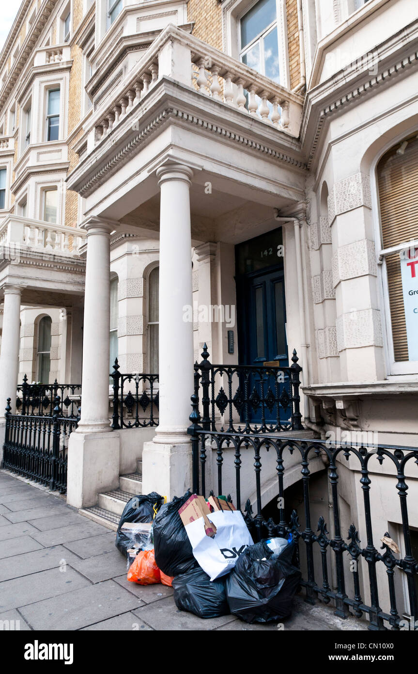 Rubbish sacks on the street outside a house in London, UK Stock Photo