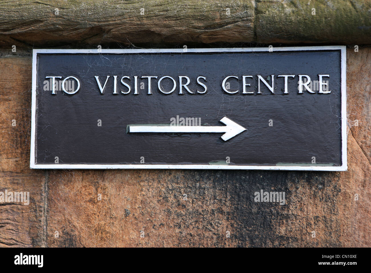 To Visitors Centre sign with arrow showing direction Stock Photo