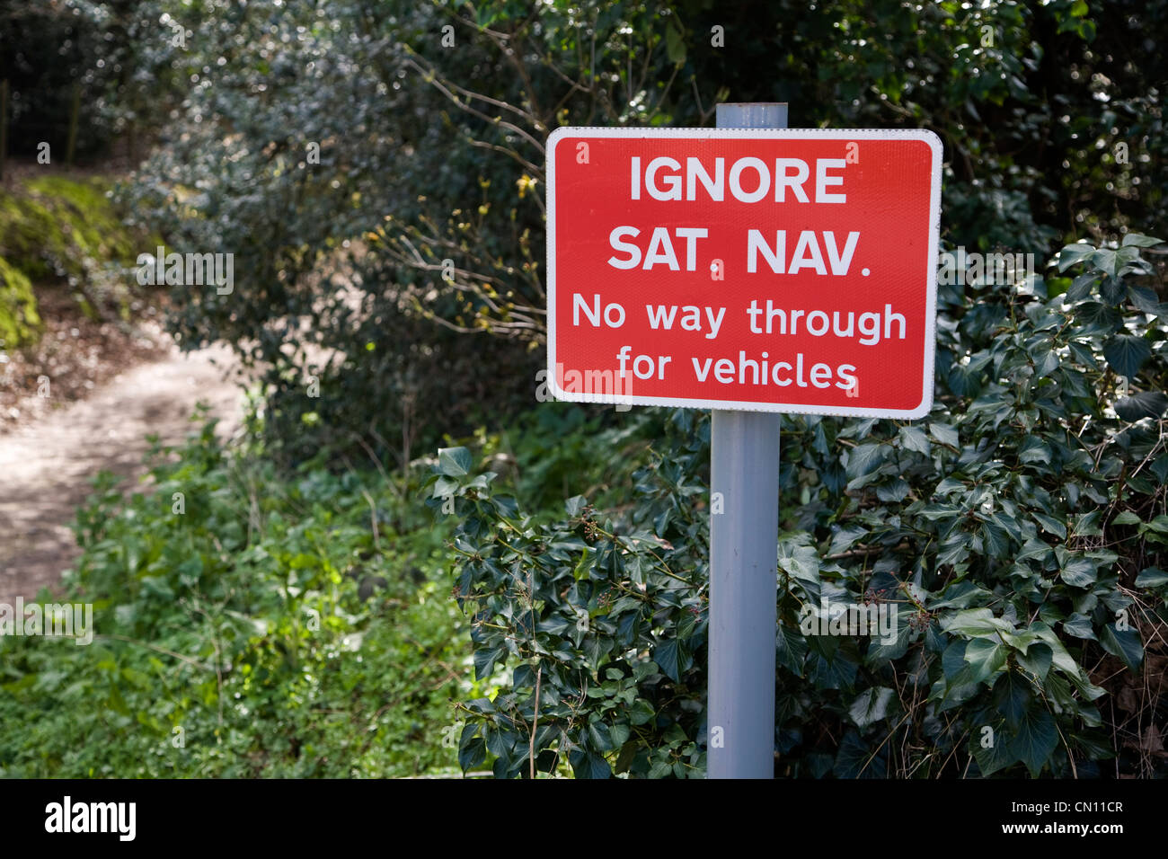 Ignore Sat Nav sign No way through for vehicles Stock Photo