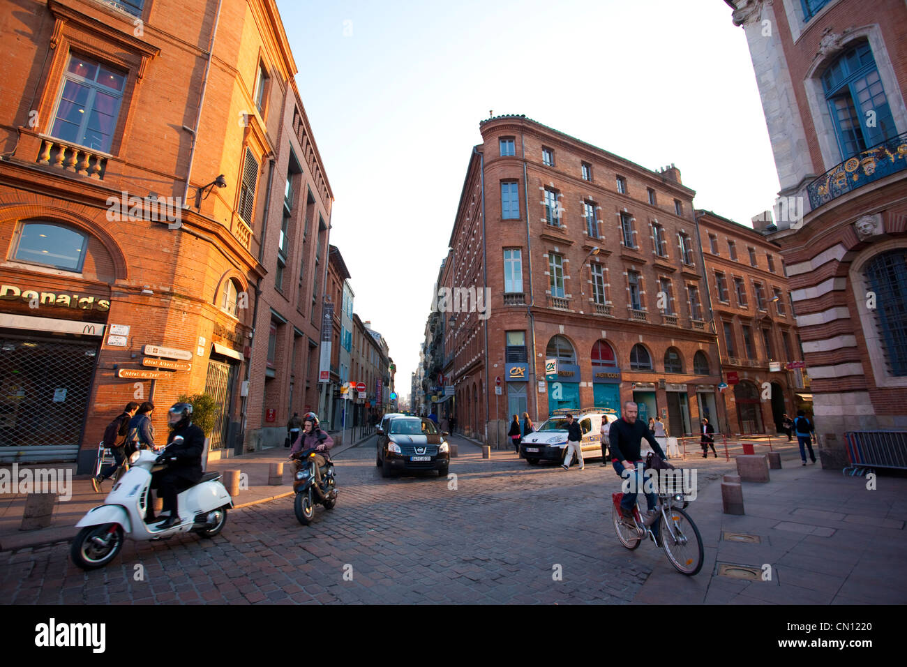 French people on their way to work in the early morning at Place du Capitole, Toulouse, France Stock Photo