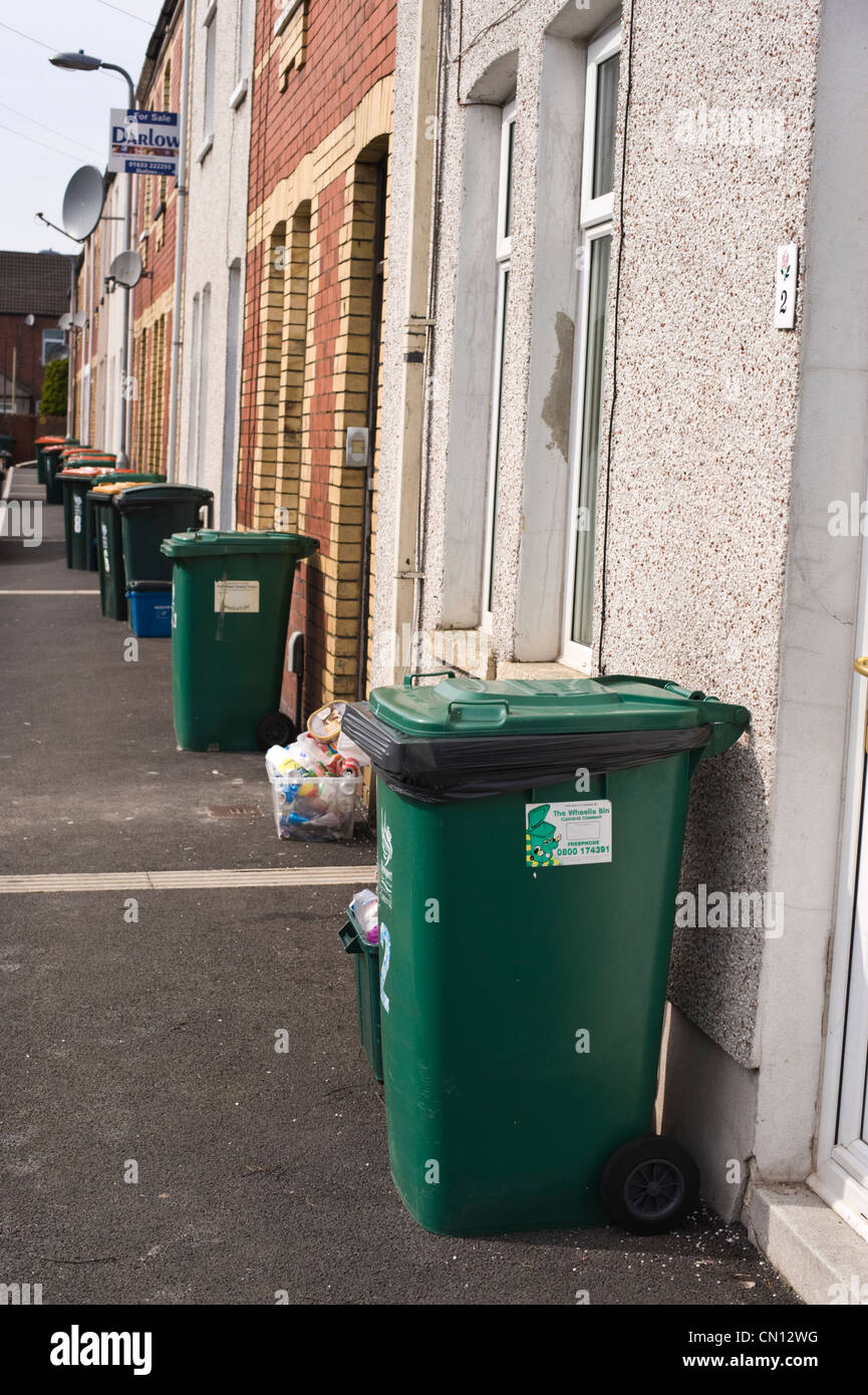Street of terraced houses in Newport South Wales UK with wheelie bins outside Stock Photo