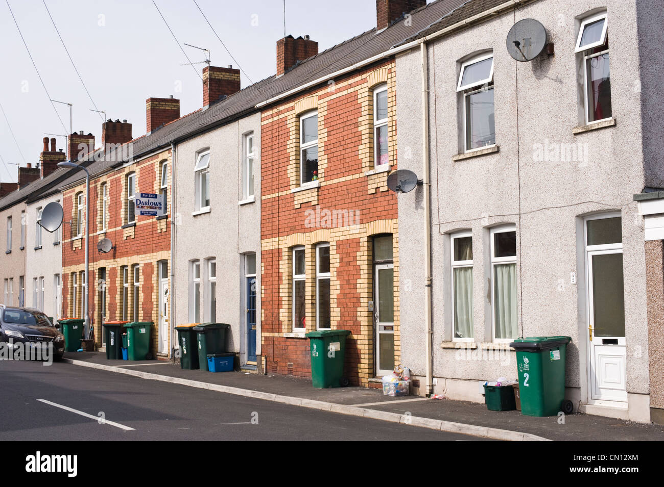 Street of terraced houses in Newport South Wales UK with wheelie bins outside Stock Photo