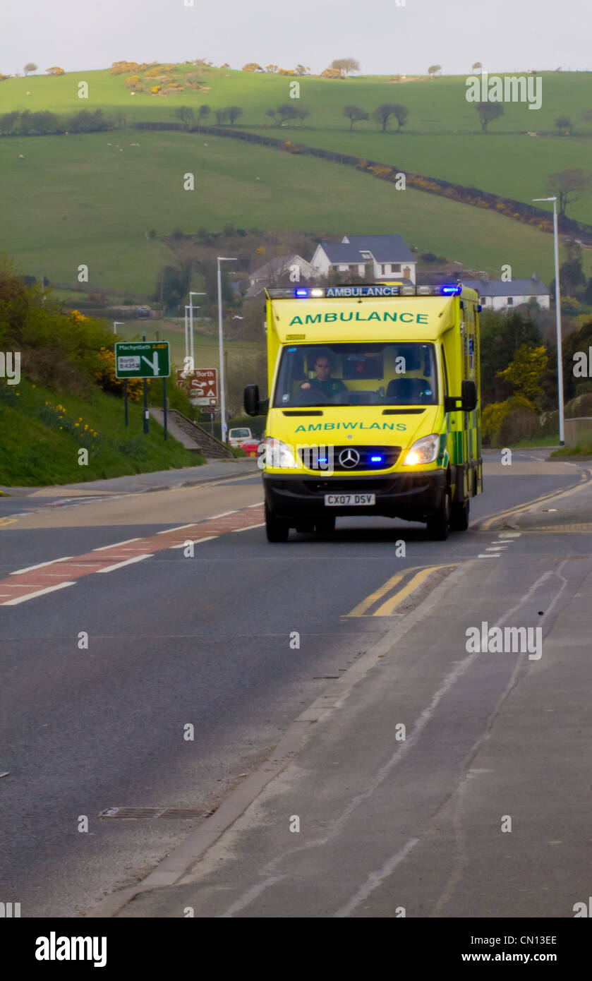 Ambulance with flashing blue lights responding to a medical emergency