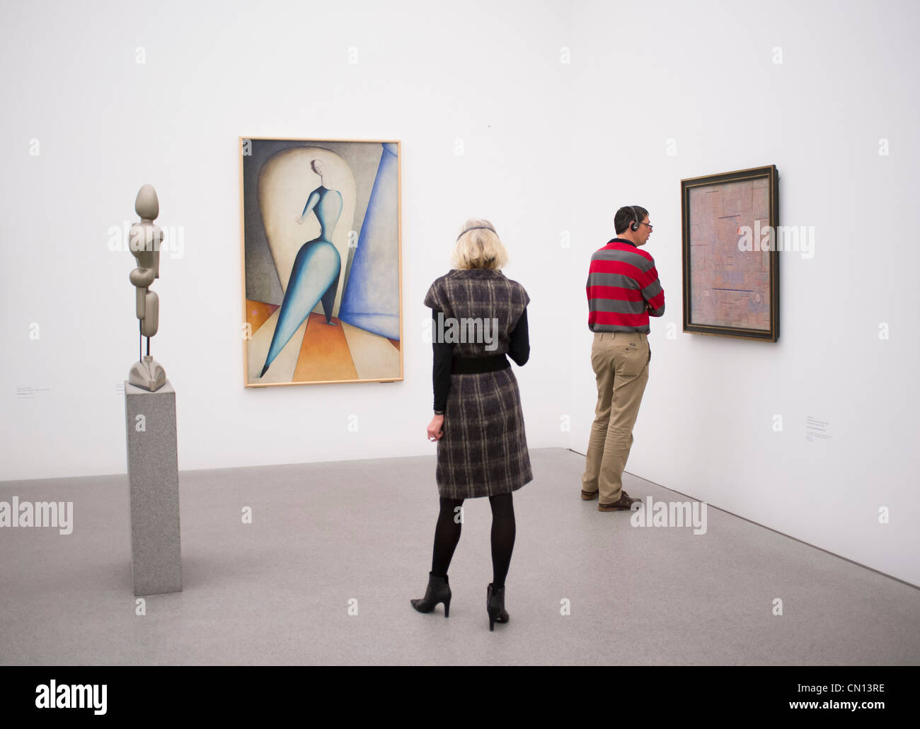 Visitors in gallery at Pinakothek Moderne art museum in Munich Germany Stock Photo