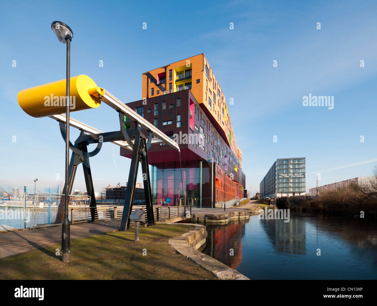 The Chips apartment building, designed by Will Alsop, beside the Ashton Canal, New Islington district, Manchester, UK Stock Photo
